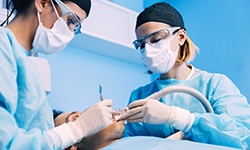 Implant dentists in Hoboken performing oral surgery