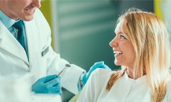 a patient discussing cost of cosmetic dentistry with a dentist