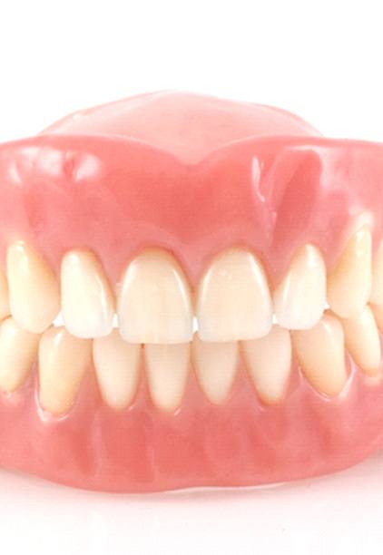 A full denture sitting on a table.
