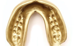 Close-up of a gold-colored mouthguard for sports