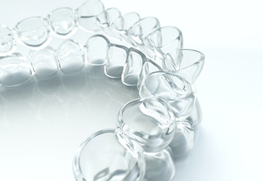 Invisalign aligners for upper and lower arches against white background