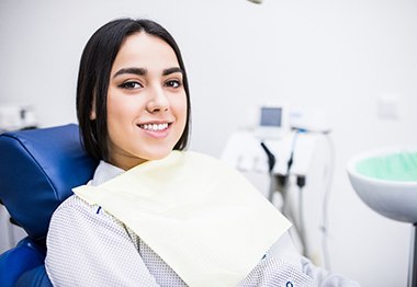 Closeup of woman smiling while sitting in treatment chair